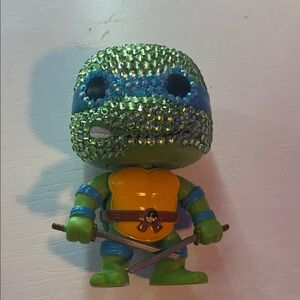 Green and Blue Reptile Figure